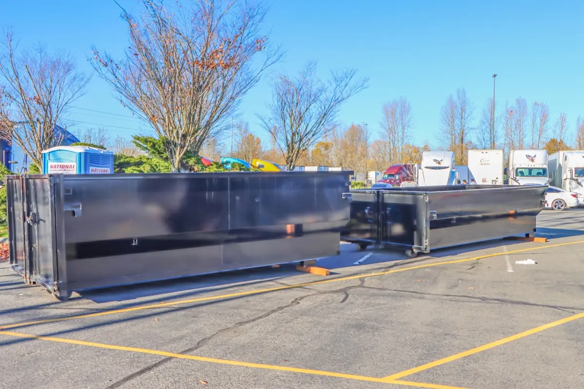 Professional dumpster rental service with roll-off container on residential driveway in Northbrook